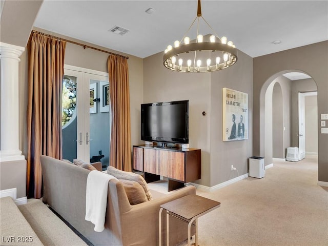 living room featuring french doors and light carpet