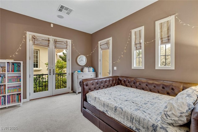 bedroom with french doors, carpet floors, and access to outside