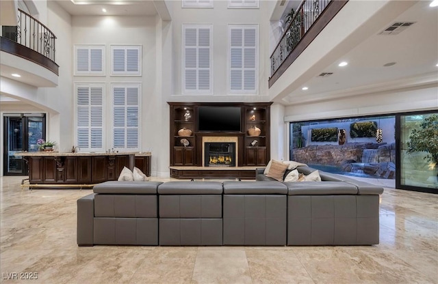 living room with a towering ceiling