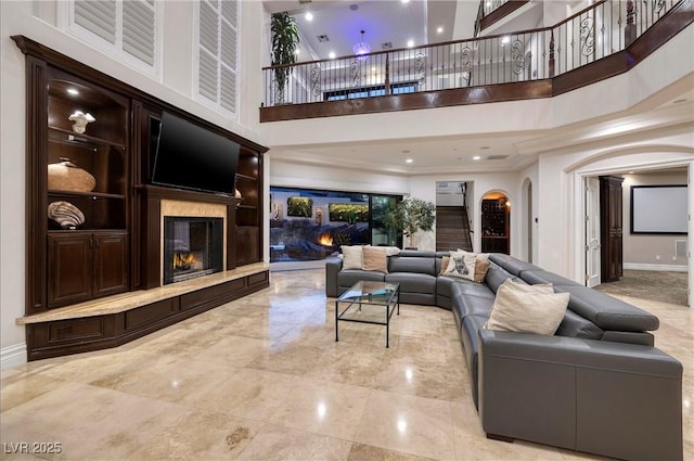 living room with a towering ceiling