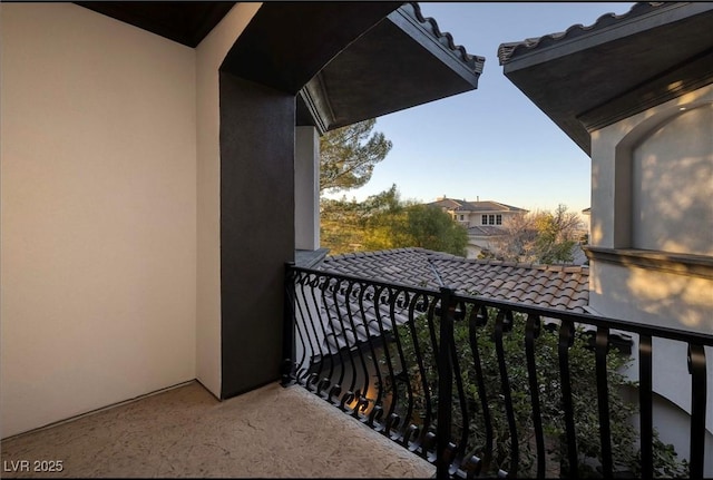 view of balcony at dusk