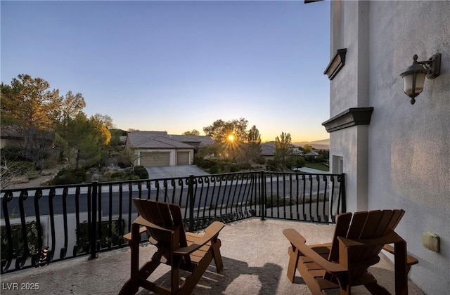 view of balcony at dusk