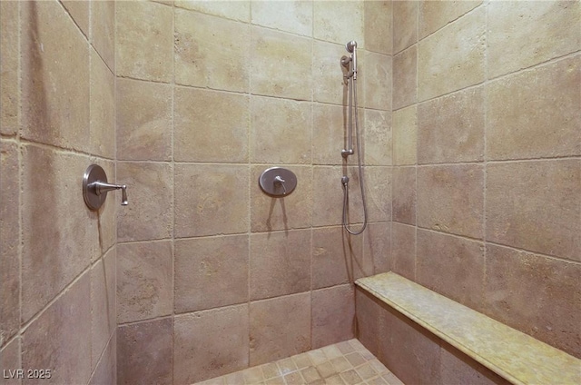 room details featuring a tile shower