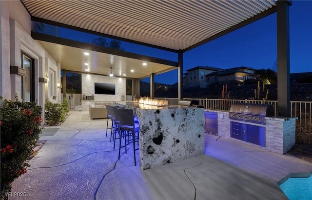 view of patio featuring area for grilling and exterior bar