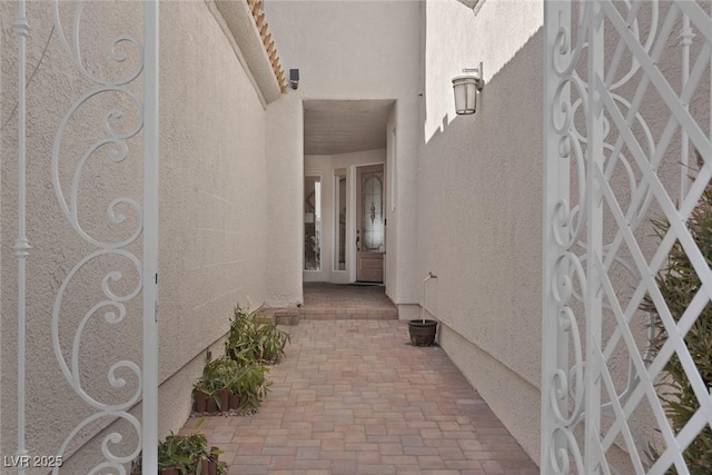 property entrance featuring stucco siding