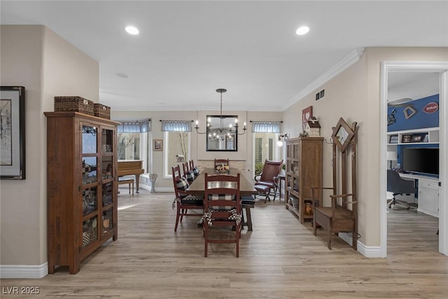 dining area with baseboards, an inviting chandelier, crown molding, light wood-type flooring, and recessed lighting