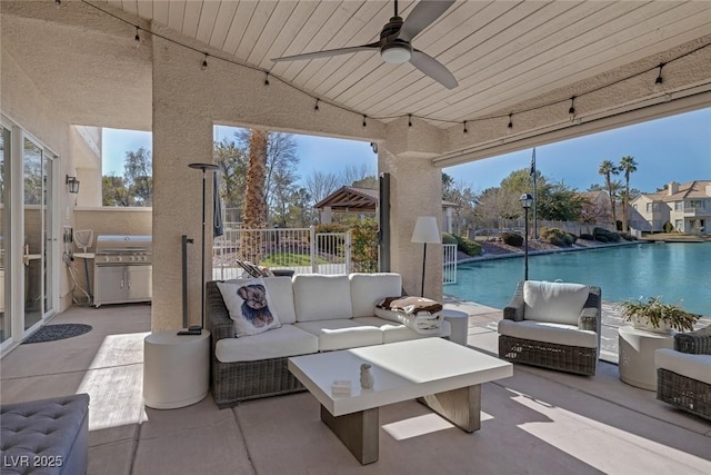 view of patio with ceiling fan, fence, an outdoor living space, and a grill