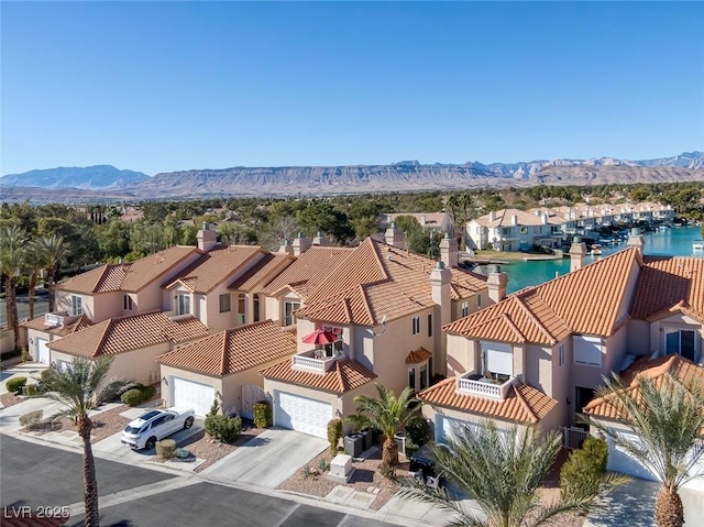 birds eye view of property featuring a residential view and a mountain view