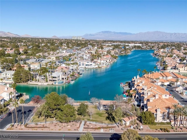 bird's eye view with a residential view and a water and mountain view