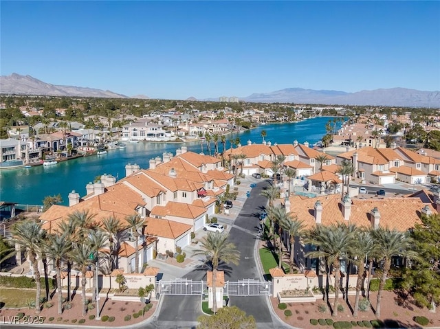 aerial view with a residential view and a water and mountain view