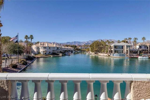 view of swimming pool featuring a water and mountain view