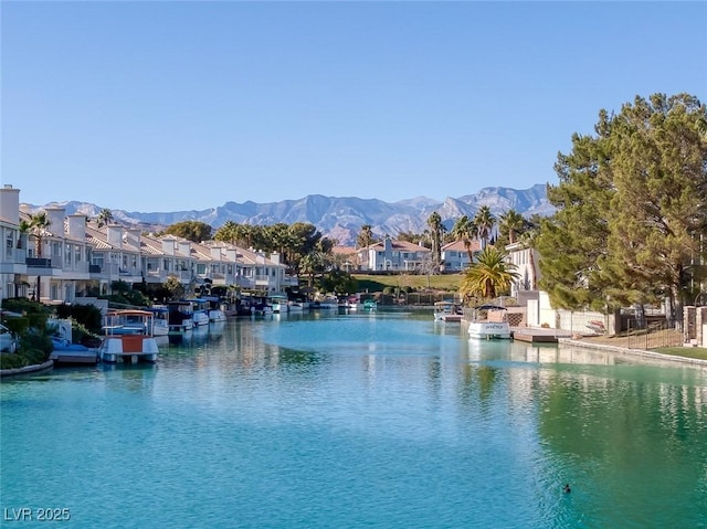 water view with a residential view and a mountain view