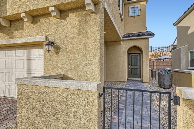 property entrance featuring a garage