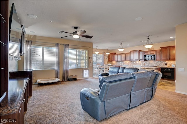 living room featuring ceiling fan and light colored carpet