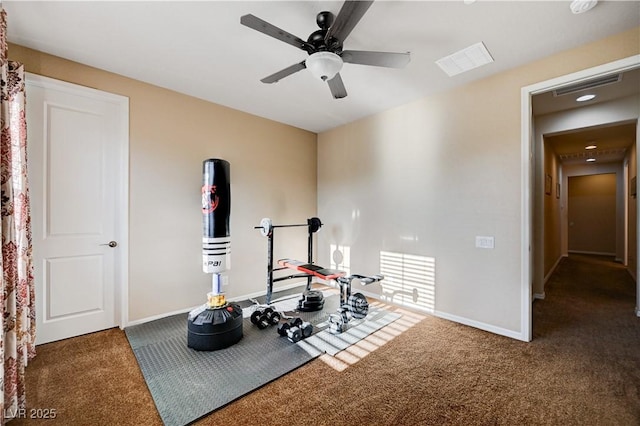 exercise area featuring carpet flooring and ceiling fan