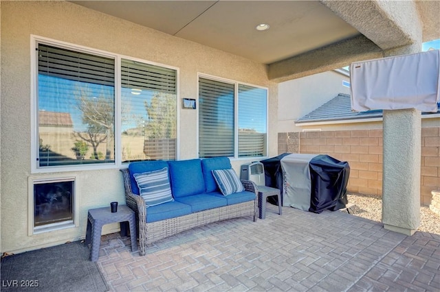 view of patio featuring an outdoor living space and a grill