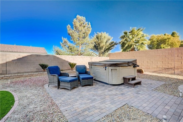 view of patio featuring a hot tub