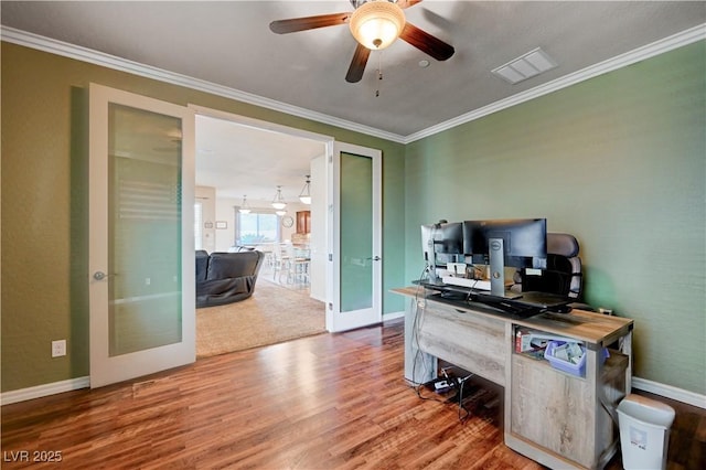 home office featuring ceiling fan, crown molding, and french doors