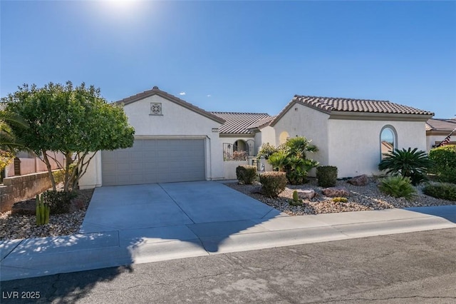 mediterranean / spanish-style house featuring a garage