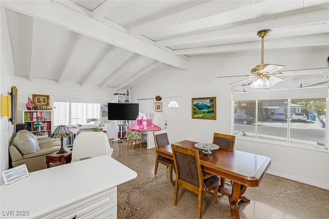 dining space with ceiling fan and lofted ceiling with beams