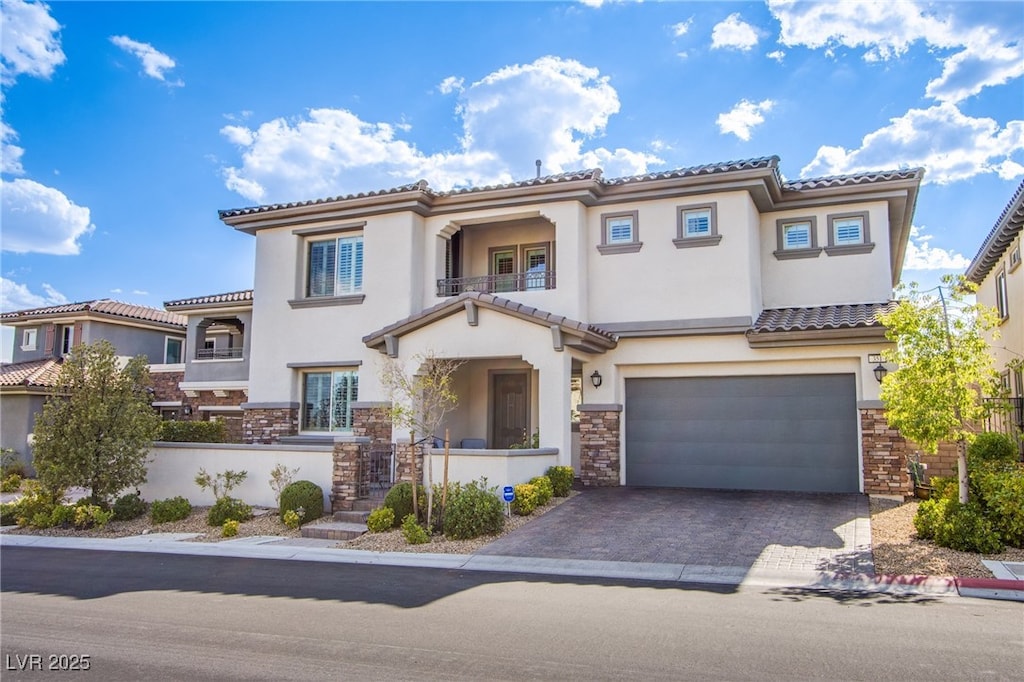 mediterranean / spanish-style house featuring a garage