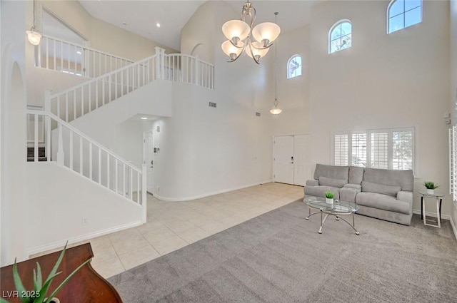 living room featuring light tile patterned floors, a high ceiling, and an inviting chandelier