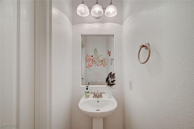 bathroom featuring sink and toilet