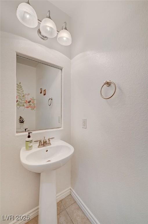 bathroom with tile patterned floors