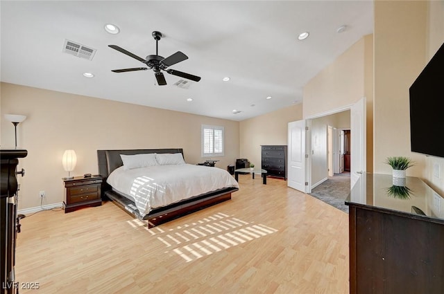 bedroom with ceiling fan and light wood-type flooring