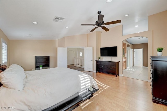 bedroom with ceiling fan and light hardwood / wood-style floors