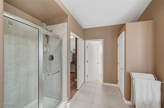 bathroom with tile patterned floors and walk in shower