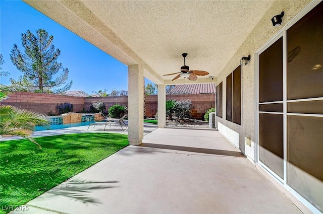 view of patio / terrace featuring ceiling fan