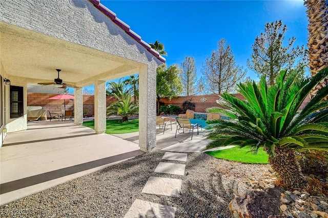 view of patio / terrace featuring ceiling fan