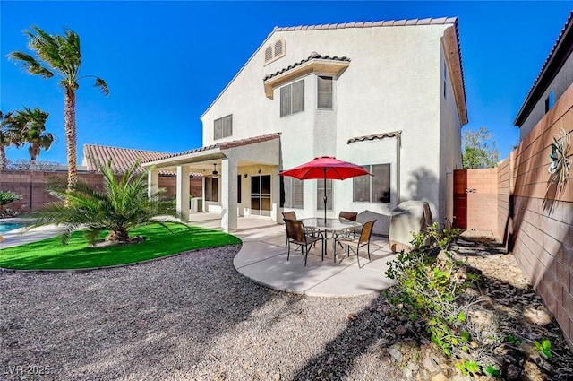 back of property featuring a patio area