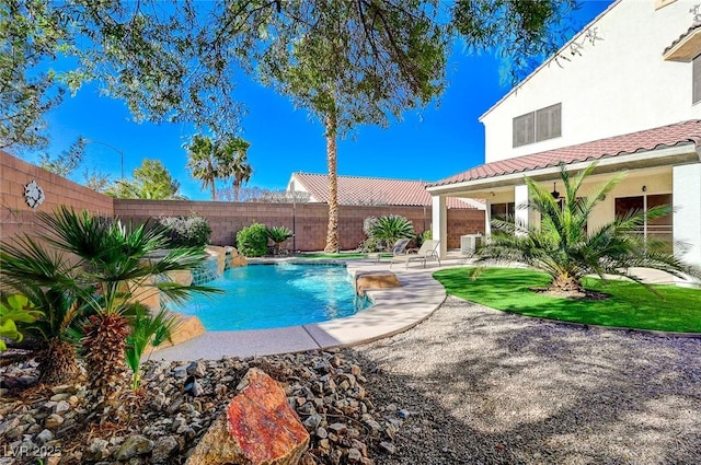 view of pool with pool water feature and a patio