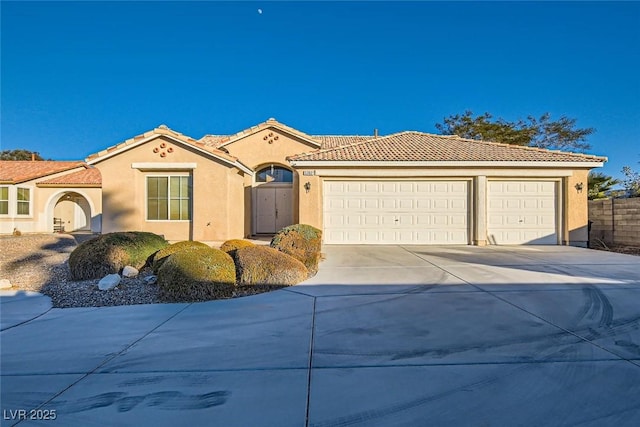 mediterranean / spanish-style house featuring a garage