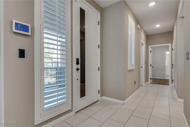 entryway featuring light tile patterned floors