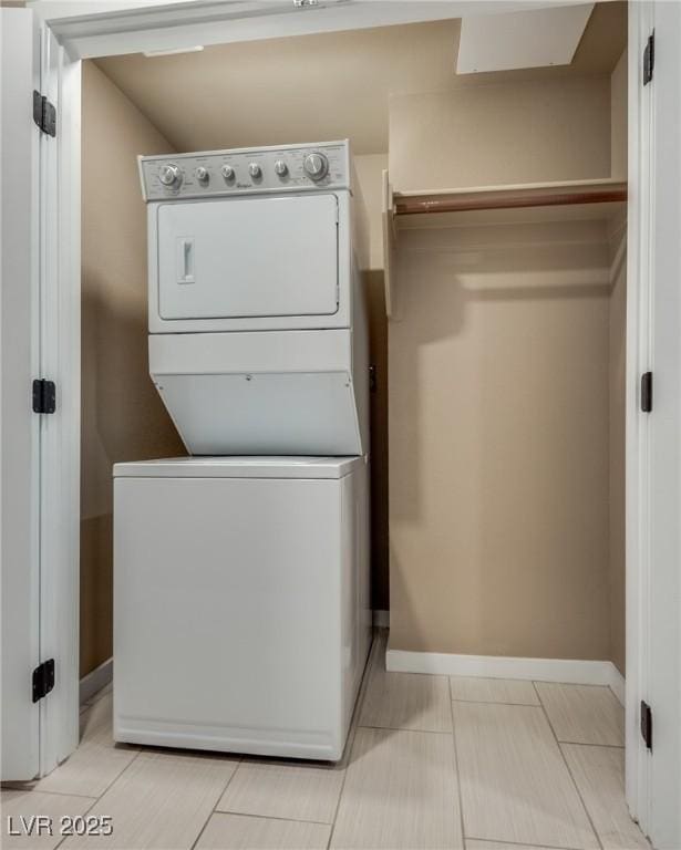 laundry room featuring stacked washer and clothes dryer