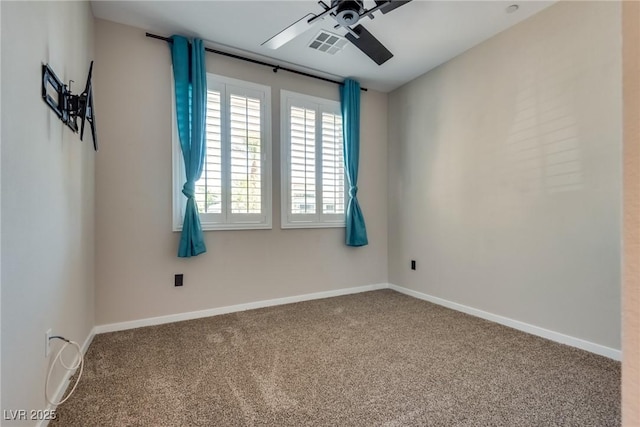 spare room featuring ceiling fan and carpet