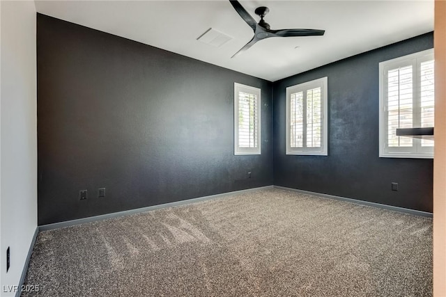 unfurnished room with carpet flooring and ceiling fan