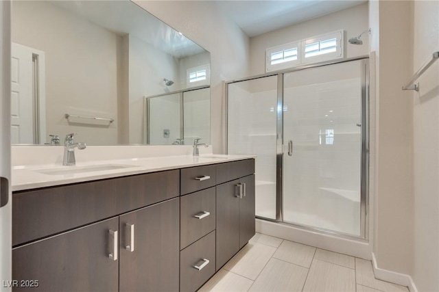 bathroom featuring tile patterned floors, vanity, and an enclosed shower