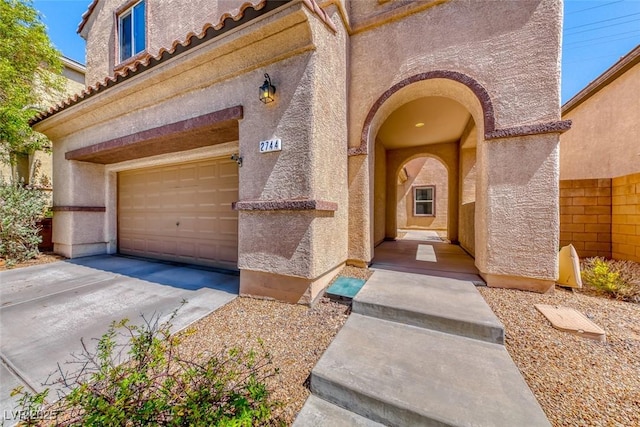 doorway to property featuring a garage