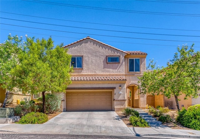 mediterranean / spanish-style home with a garage