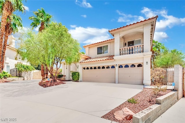 mediterranean / spanish-style home featuring a balcony and a garage