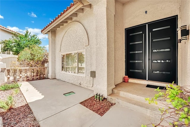 doorway to property featuring a porch