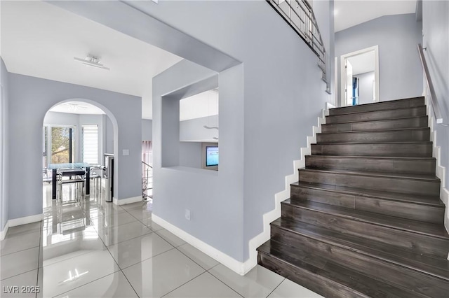 staircase with tile patterned floors