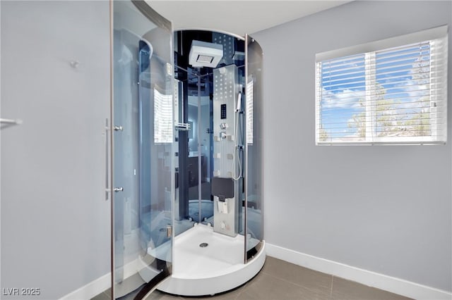 bathroom with tile patterned flooring and an enclosed shower