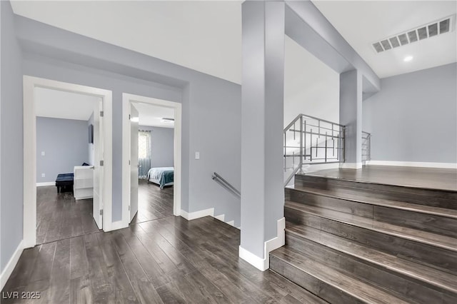 stairs featuring hardwood / wood-style flooring