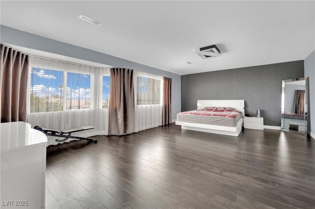 unfurnished bedroom with dark wood-type flooring