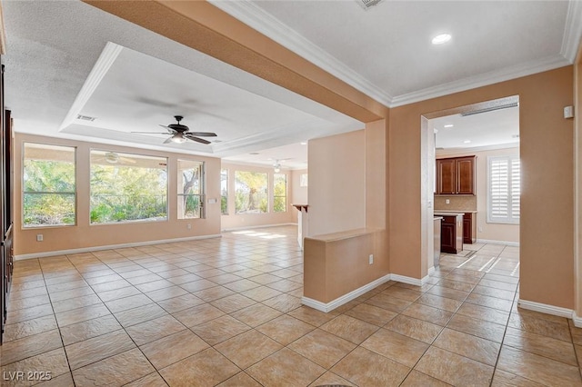 unfurnished room with ceiling fan, crown molding, light tile patterned floors, and a healthy amount of sunlight